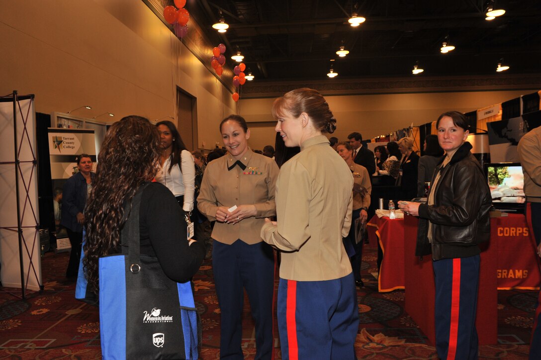 Female Marine aviators from across the United States assist 8th Marine Corps District officer selection officers in attracting conference attendees to the Marines’ recruiting booth at the 23rd Annual Women in Aviation International Conference held March 8-10, 2012, in Dallas. The conference’s 3,350 visitors ranged from high school students, to workers for major airlines, surviving members of the Women Airforce Service Pilots of World War II, and service members representing aviation in the U.S. military.